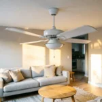 White ceiling fan with slightly blurred blades showing wobble motion in a modern living room