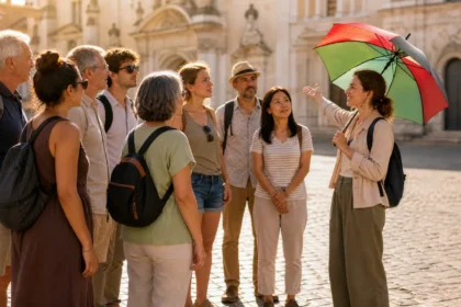 A tour guide leading a small group on a free walking tour through a historic European city square